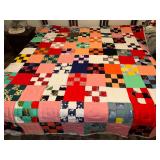 Block and square quilt with plaid back