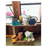Rolling Garden Cart with Assorted Planters, Watering Cans, and Gardening Supplies