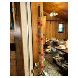 Vintage yardstick hanger full of old yardsticks some local