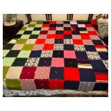 Tied patchwork quilt with green back