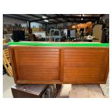 Sliding louvered cabinet