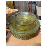 Yellow depression glass dinner plates and serving bowl