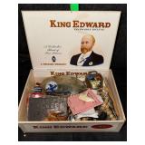 Cigar box of vintage goodies and trinkets- belt buckles, bell, carvings, pins, and more