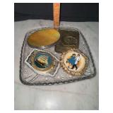 4 vintage belt buckles in glass dish