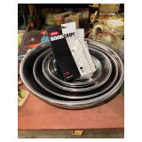 Set of stainless steel kitchen bowls and OXO scrubber