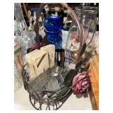 Decanter label tags, cigar tins and shot glasses in wire basket