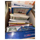 Box with freedom alert, game and books