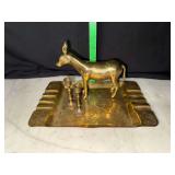 Brass etched ashtray with miniature candle sticks and donkey figure