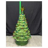 Ceramic lighted Christmas tree has chip on top by star