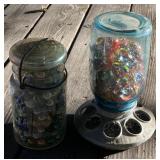 Jar and Poultry Feeder Full of Marbles Jar and Poultry Feeder Full of Marbles