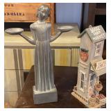 Statue and Wooden House