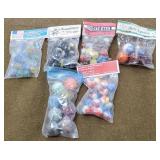 6 Small Bags Of Marbles