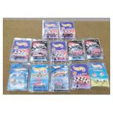 12 Hot wheels New in Kar Keepers