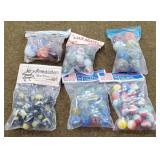 6 Small Bags Of Marbles