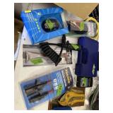 Tabletop of misc fishing/household items