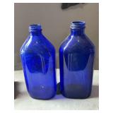 Pair of Milk of Mag bottles