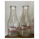 Pair of Borden milk bottles