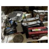 Tabletop of misc fishing, shop items