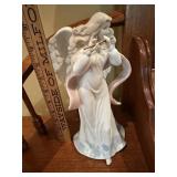 Porceain Angel playing a flute figurine