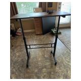 Adjustable serving table