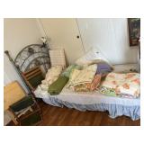 Twin metal bed with bedding