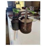 Pair of metal oil cans
