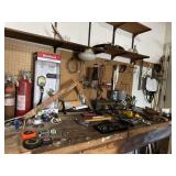 Misc contents of garage shoptable and wall