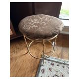 Brass legs, padded stool