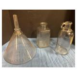 Glass funnel and two glass jars