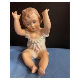 Ceramic piano doll