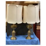 Two brass looking lamps 33 inches tall