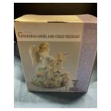 Musical guardian angel and child figureine