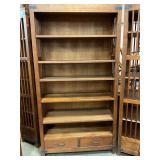 Plantation style bookshelf with drawers