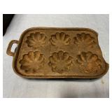 Cast-iron muffin pan with broken