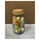 Blue mason jar of marbles