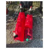 Four plastic gas cans
