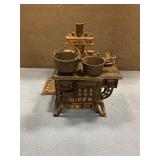 Miniature queen, cast-iron stove with utensils