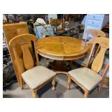Kitchen table with three chairs and one leaf