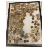 assorted foreign coins in  frame