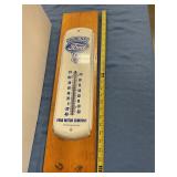 Ford thermometer on wooden plaque
