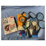 Magnifying glass, stapler & ID Vault