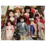 Lot of porcelain dolls & some stands