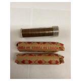 Three rolls of pennies