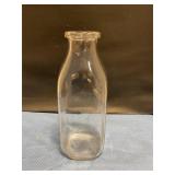 Vintage clear, glass milk bottle