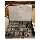 Tin container of assorted size screws