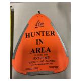 Hunter in area triangle material sign