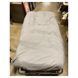 Twin fold-up cot on wheels