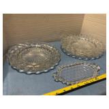 Four glass plates and butter dish