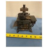 Miniature queen, cast-iron stove with pots