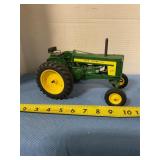 Plastic John Deere 720 with broken steering wheel